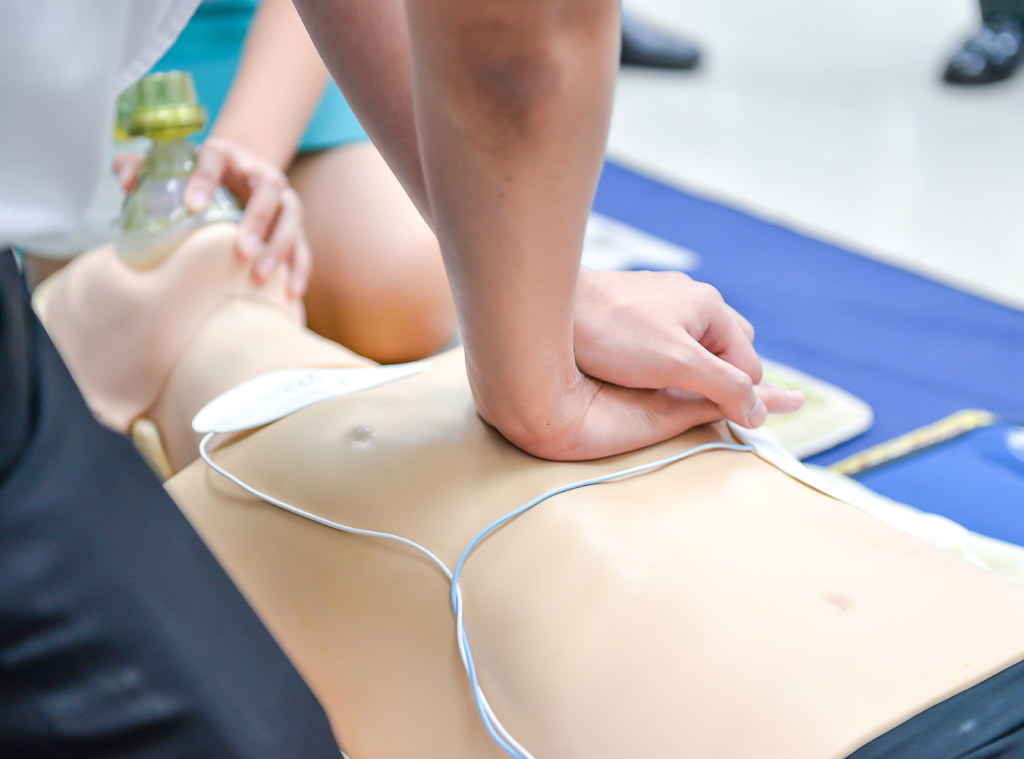 Trainer provide basic emergency life support, performing CPR